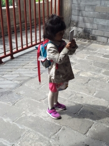 A very small bell-tower photographer who was taking her job very serriously