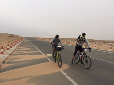 Ivan (left) and Rob (right) skirting the end of the dunes forming on the road