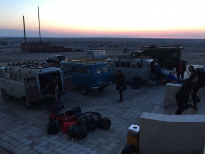 Pre-dawn loading of bags into vans
