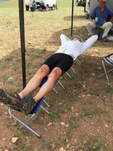 Ron showing us how five camp stools can make a comfortable bed!