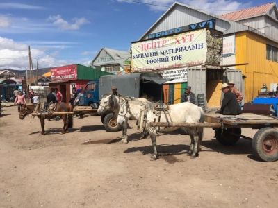 Local couriers waiting for a job outside the market