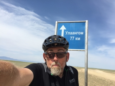 Time warp - I've ridden 14km since the last sign but got 26km closer - strange things happen on the plains of Western Mongolia !