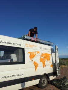 Jordan loading bikes of those who have taken a taxi into Almaty onto the roof of the van