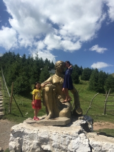 No idea about the statue, but the little girls wanted to pose for me