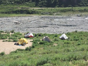 Actually a view of my tent beside the river, mine's the silver one at back left