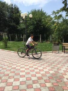 This lad was hanging out with Jordan in town (who was there to give us directions to our homestay) and wanted to ride my bike which given his height he did really well!