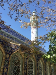 A mosque through the trees in Bojnord
