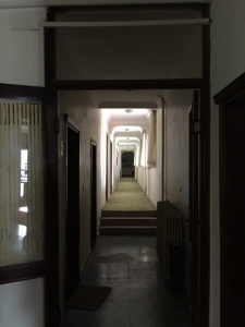 The endless corridor of closed up rooms