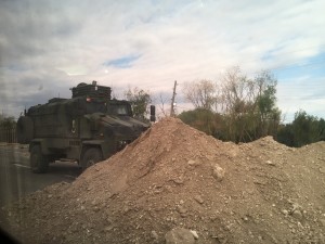 Sneaky photo of the roadblock - several truck-loads of rock from the nearby quarry and an APC to reinforce the message!